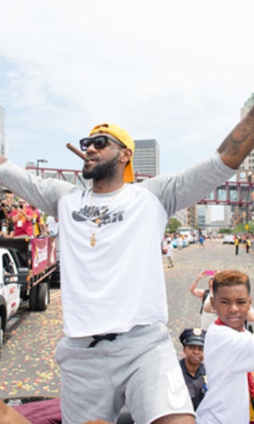 Crowd swarms Cleveland for Cavs title parade, rally